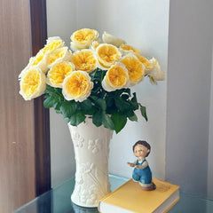 Beatrice rose arrangement in embossed white vase with green leaves